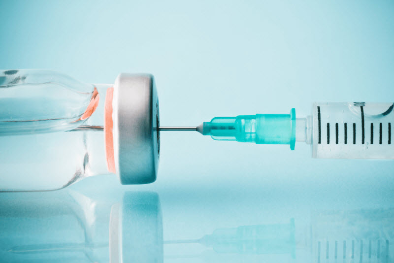 Syringe and bottle of vaccine
